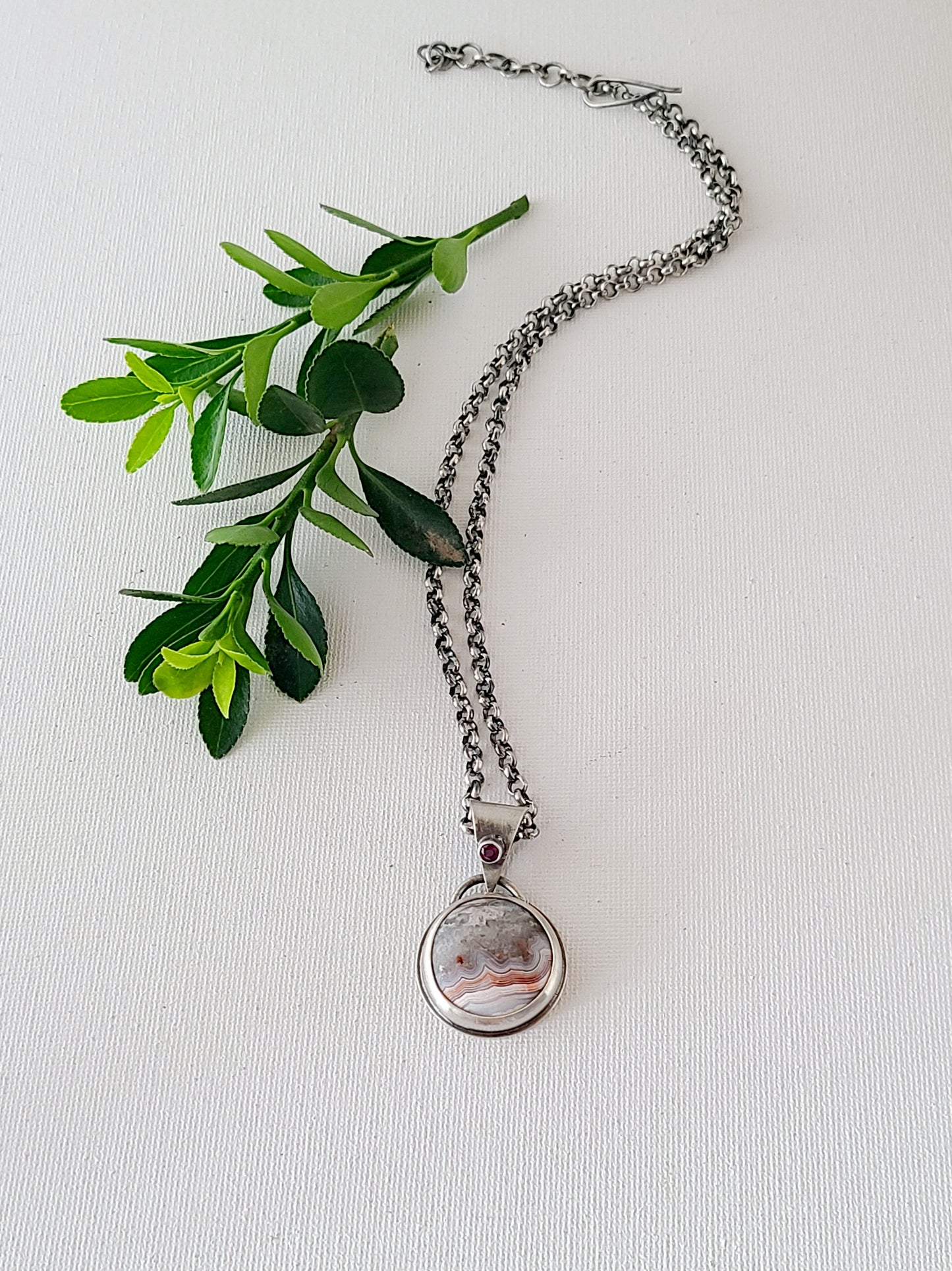 Laguna Lace Agate and Garnet Pendant-oxidized silver