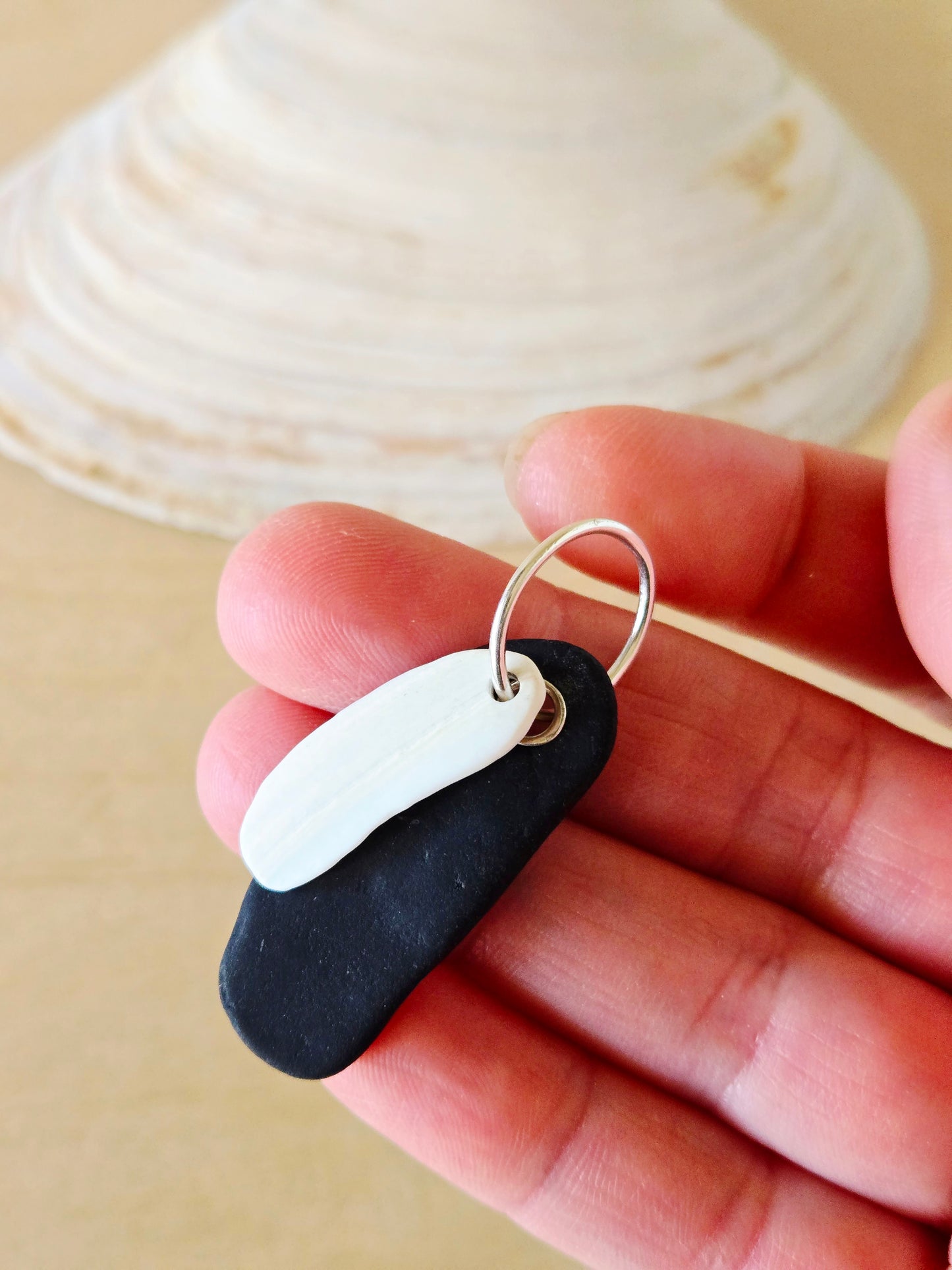 Black Beach Stone & White Shell Charm