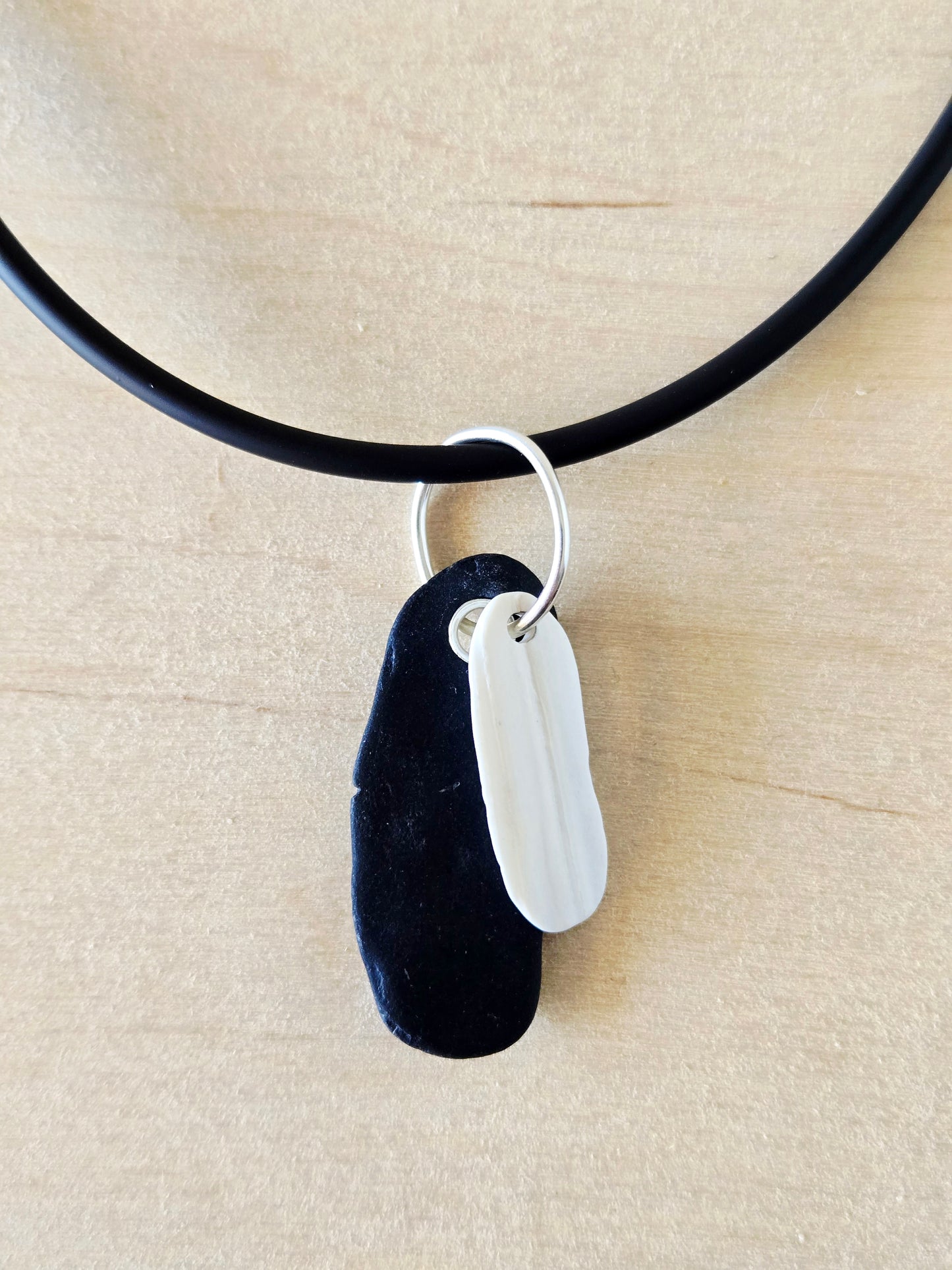 Black Beach Stone & White Shell Charm