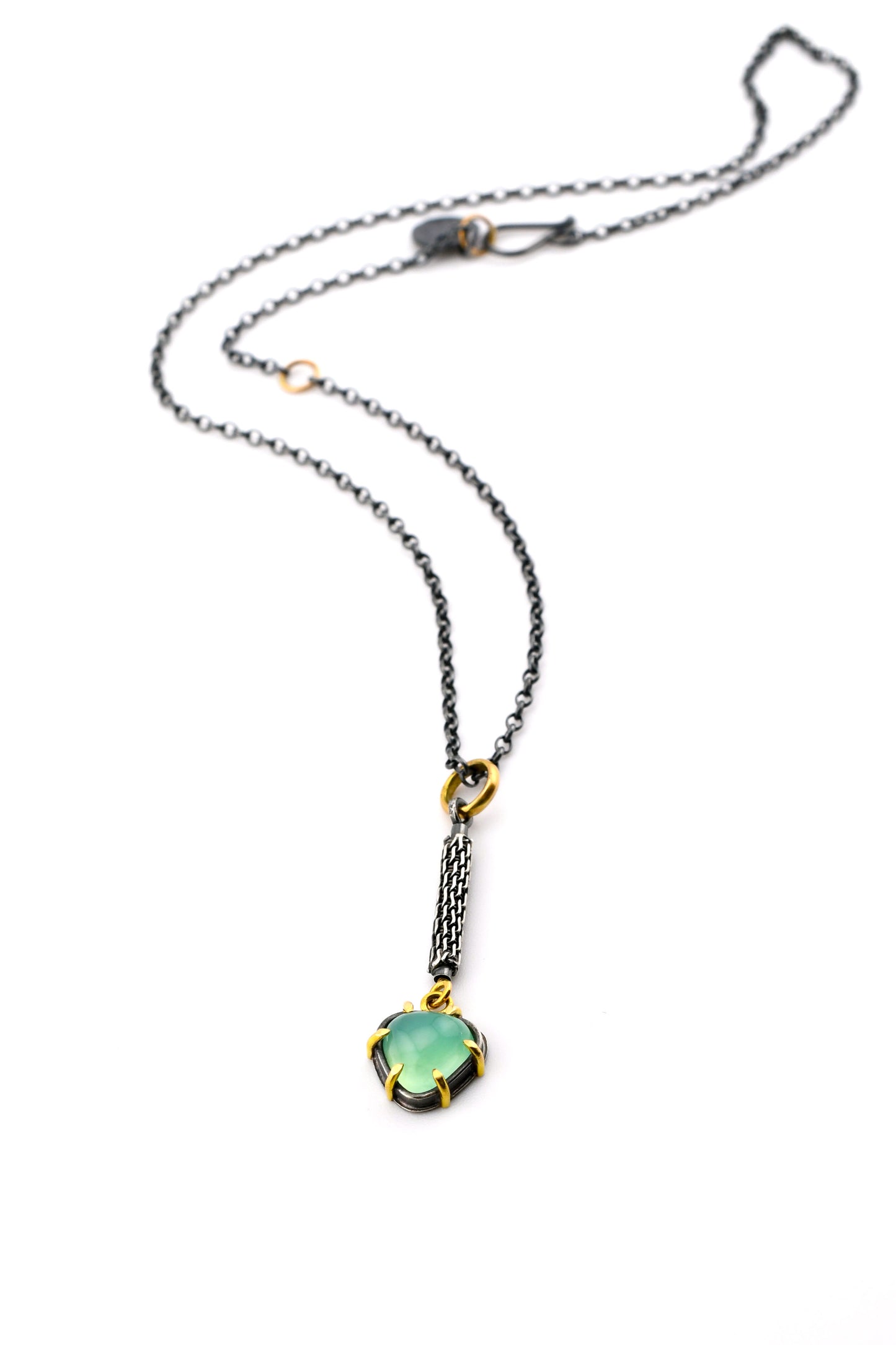Necklace with a green pendant on a white background