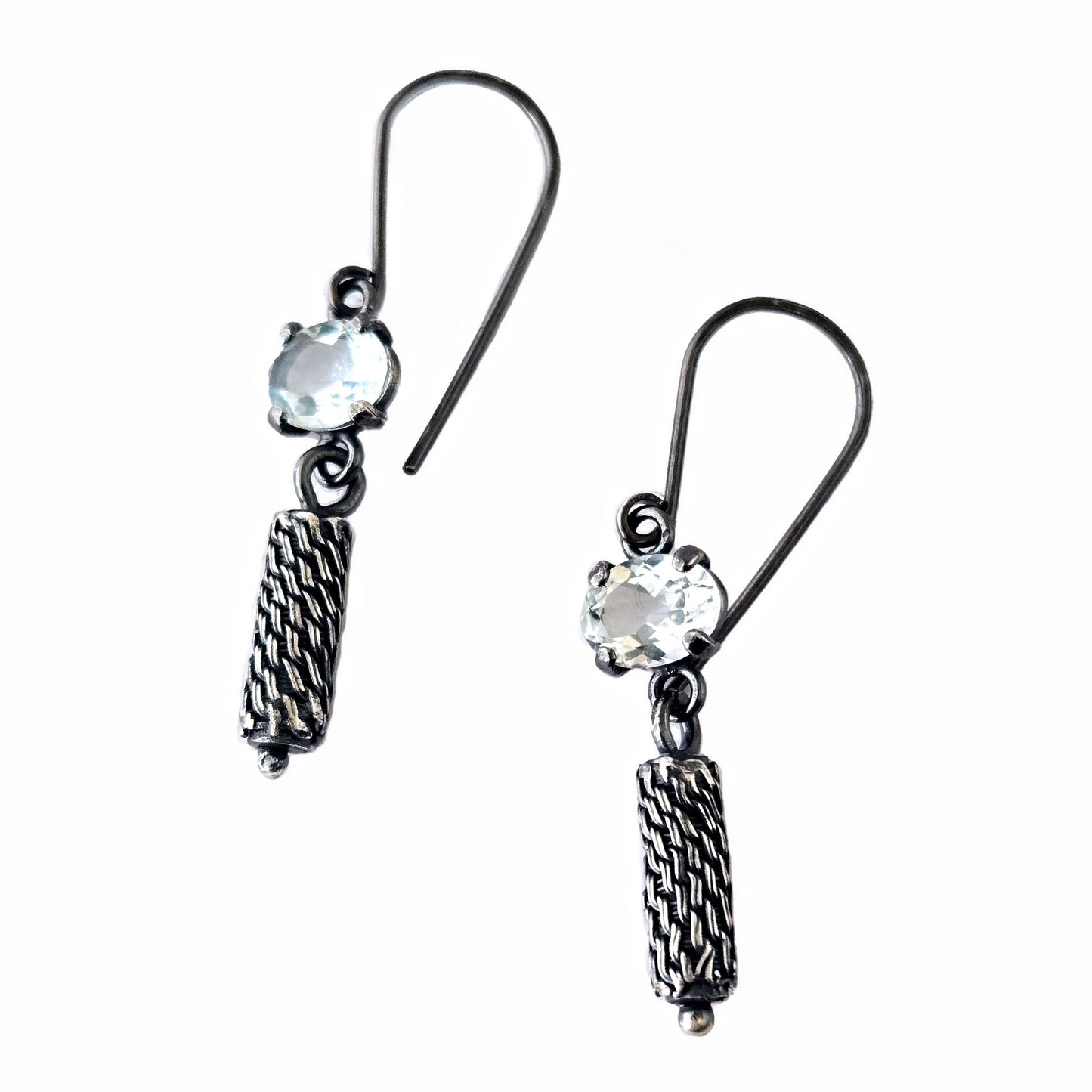 pale blue gemstone earrings with textured pendant on a white background