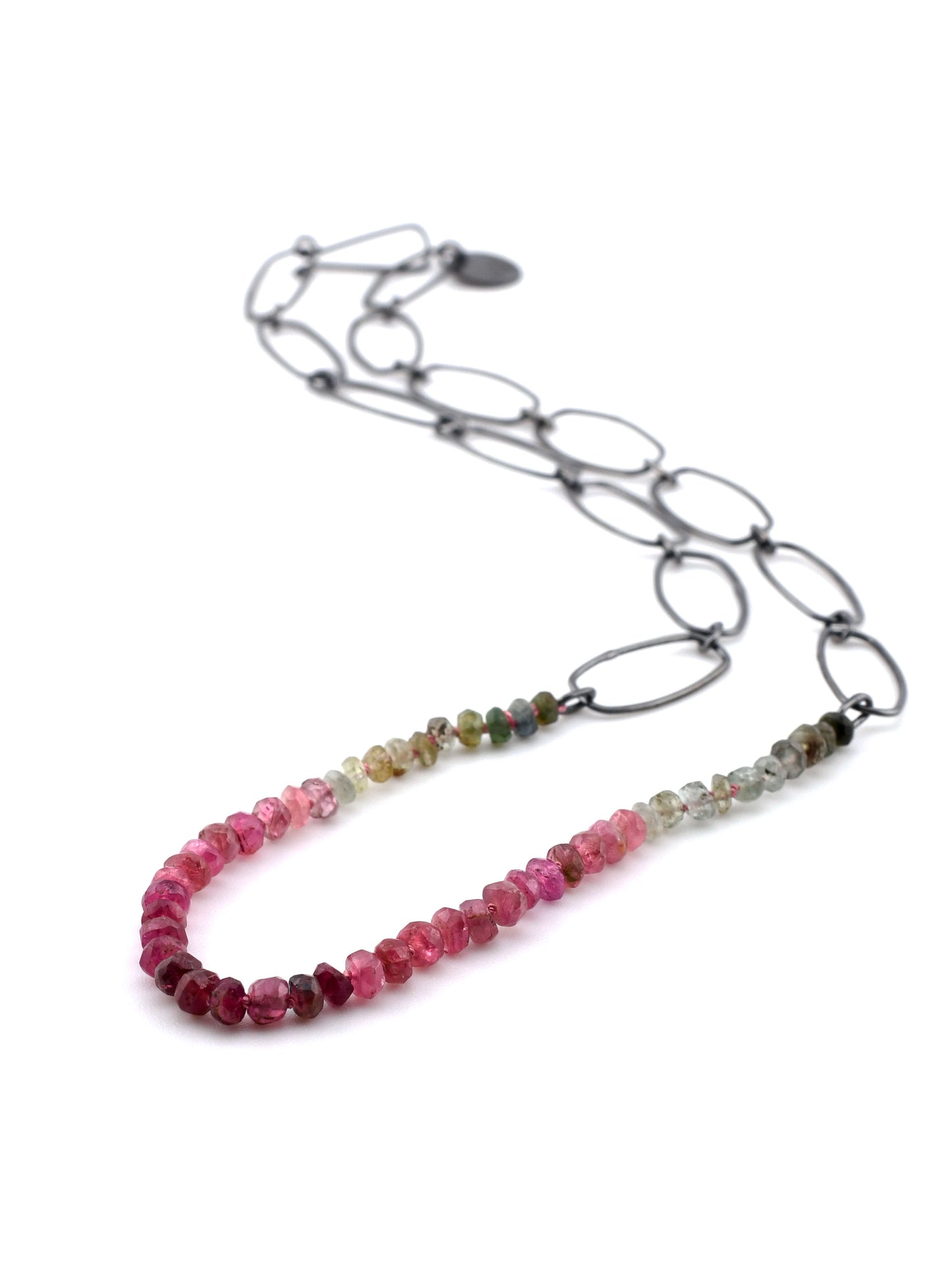 Necklace with multicolored beaded chain on a white background