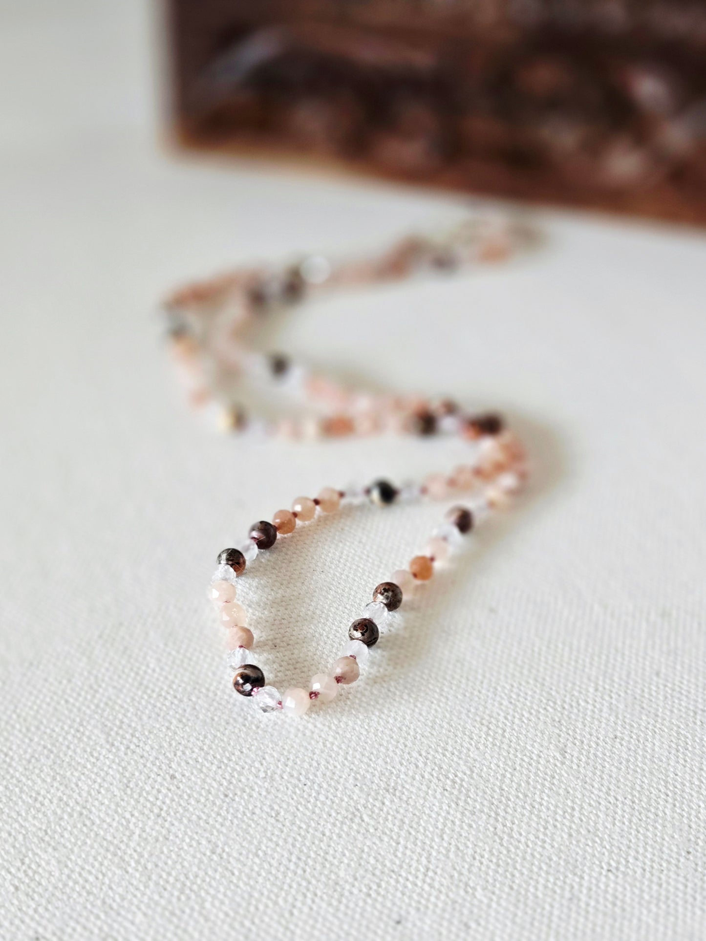 beaded necklace on light background