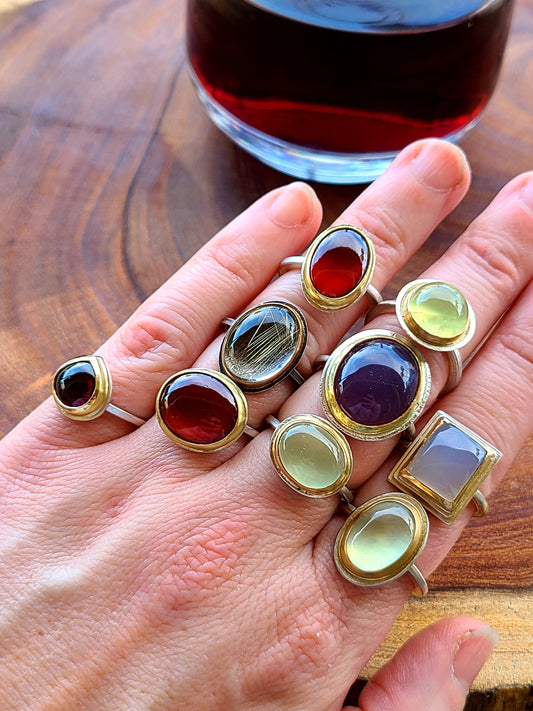 Drinking wine and stacking all the Gemstone rings
