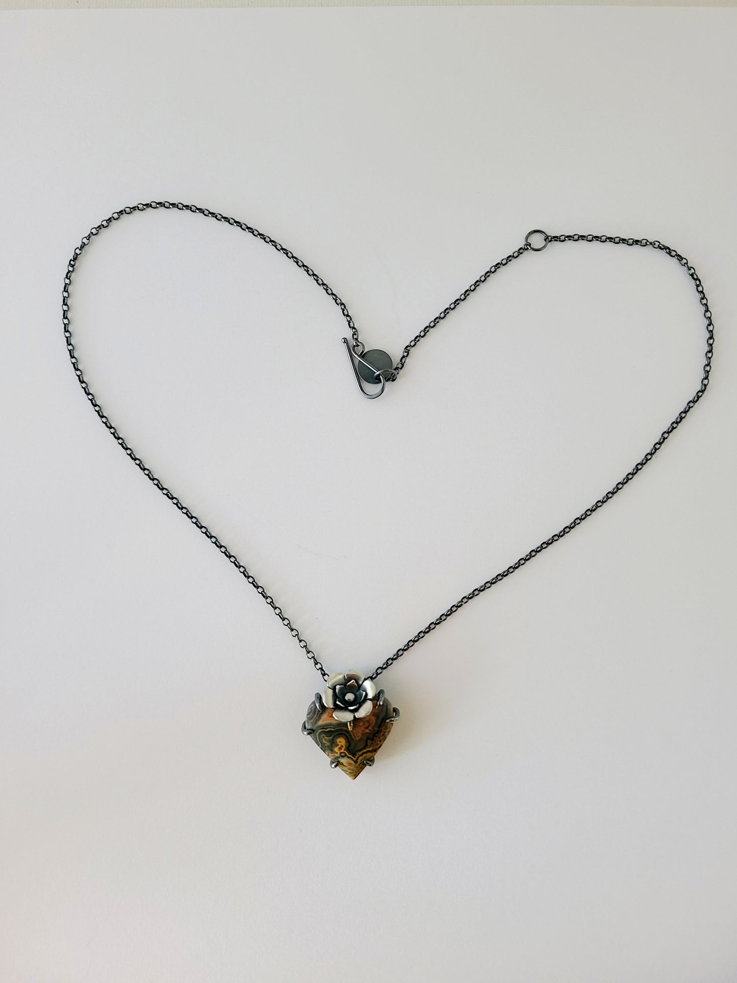 Flowering Heart Pendant with Flowering Tube Onyx