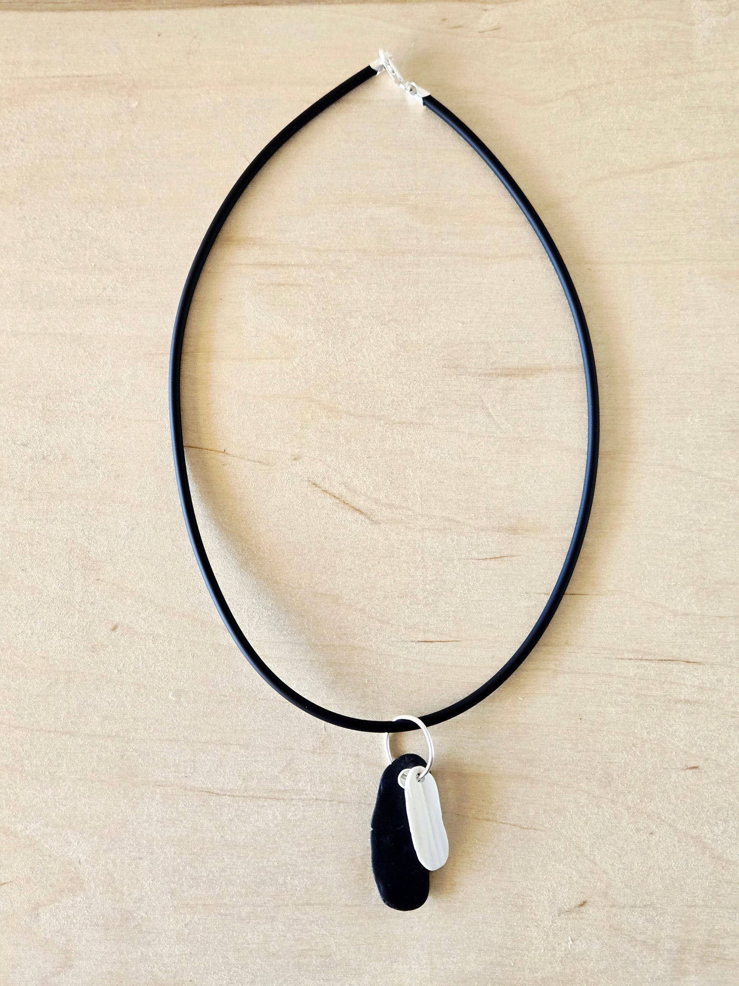 Black Beach Stone & White Shell Charm