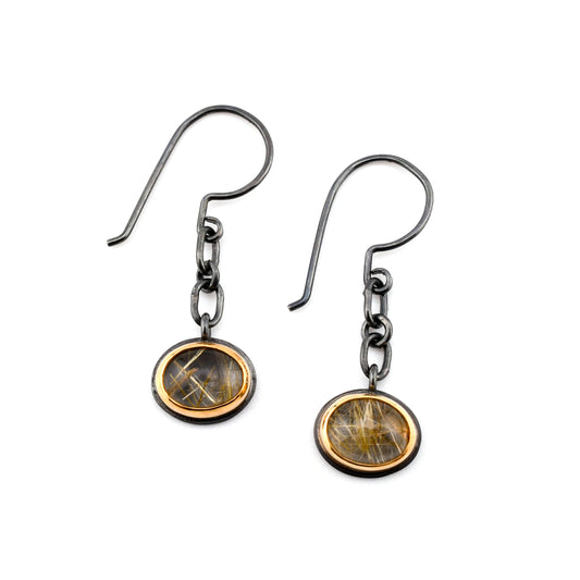 Black silver chain earrings with oval rutilated quartz set in 14k gold bezels shown on a white background