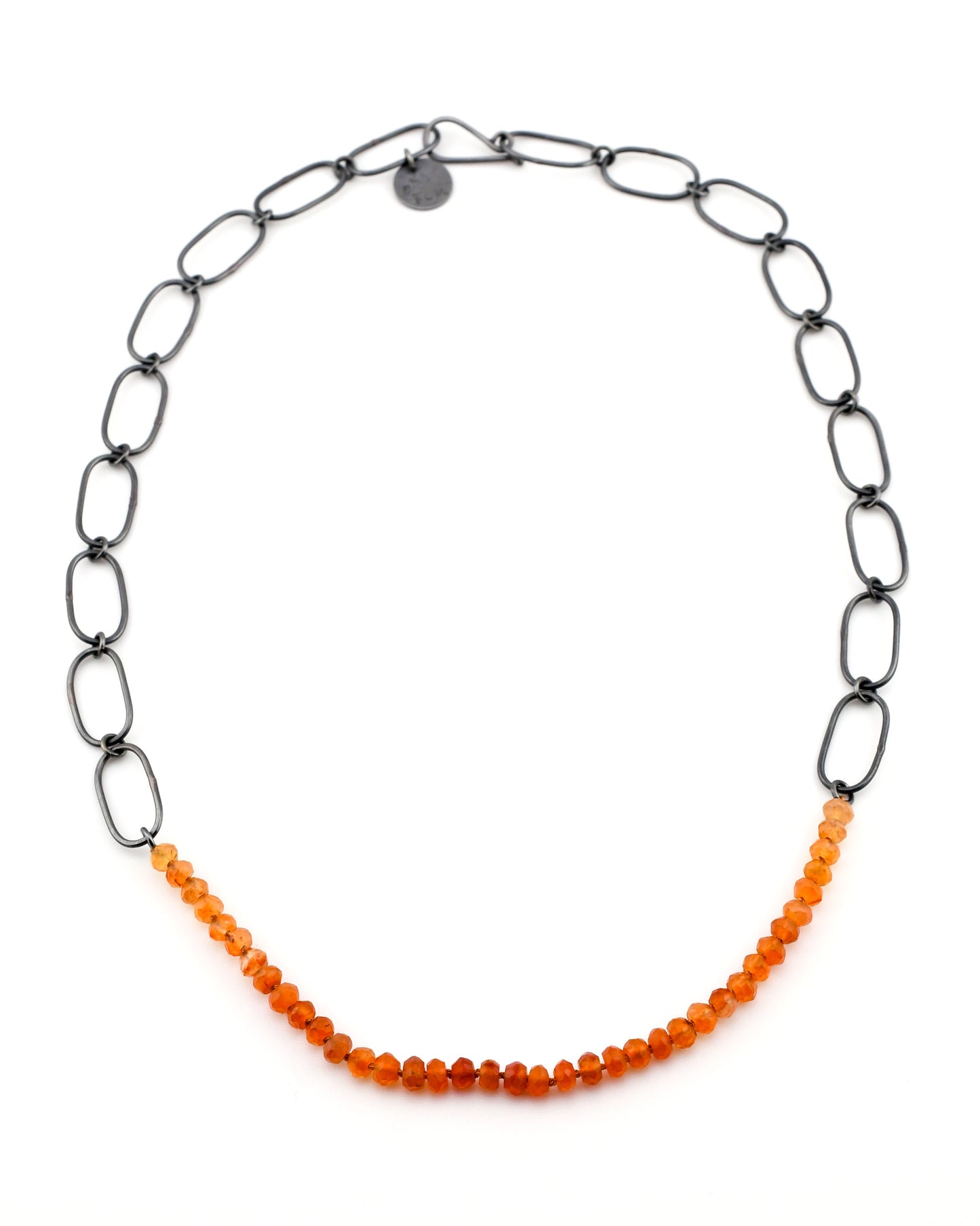 Necklace with black chain and orange beads on a white background