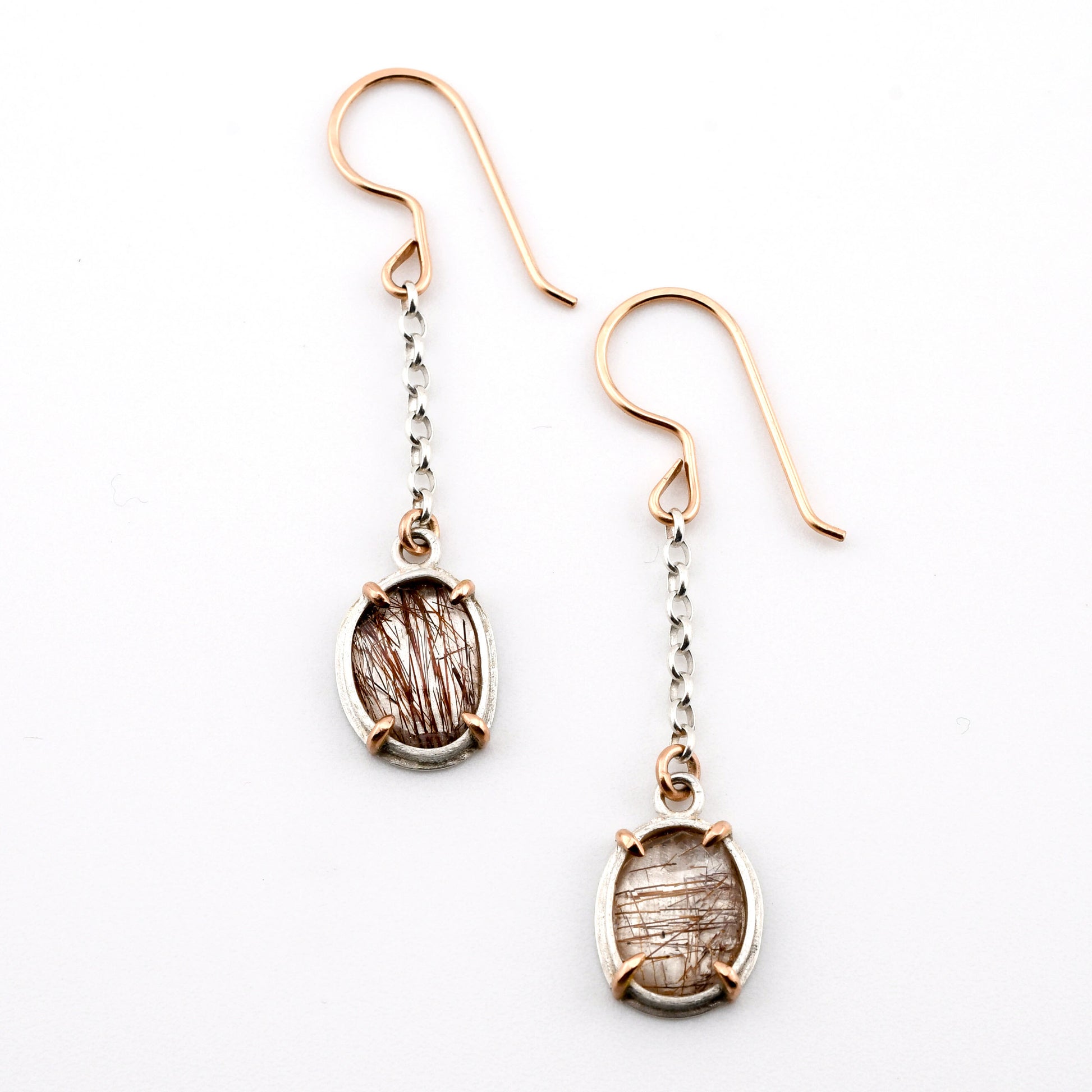Pair of earrings with gemstones on a white background