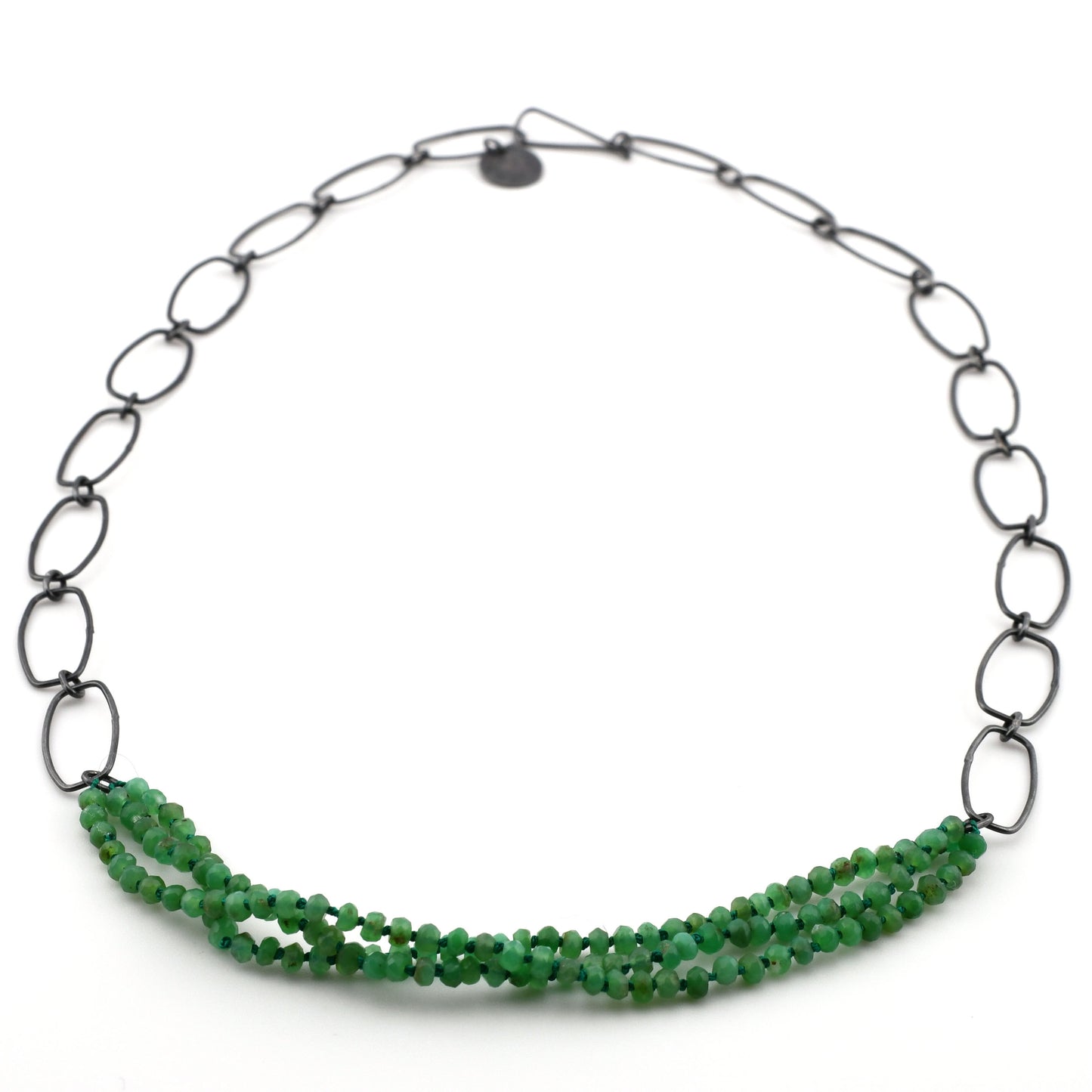 Necklace with green beads and black chain on a white background
