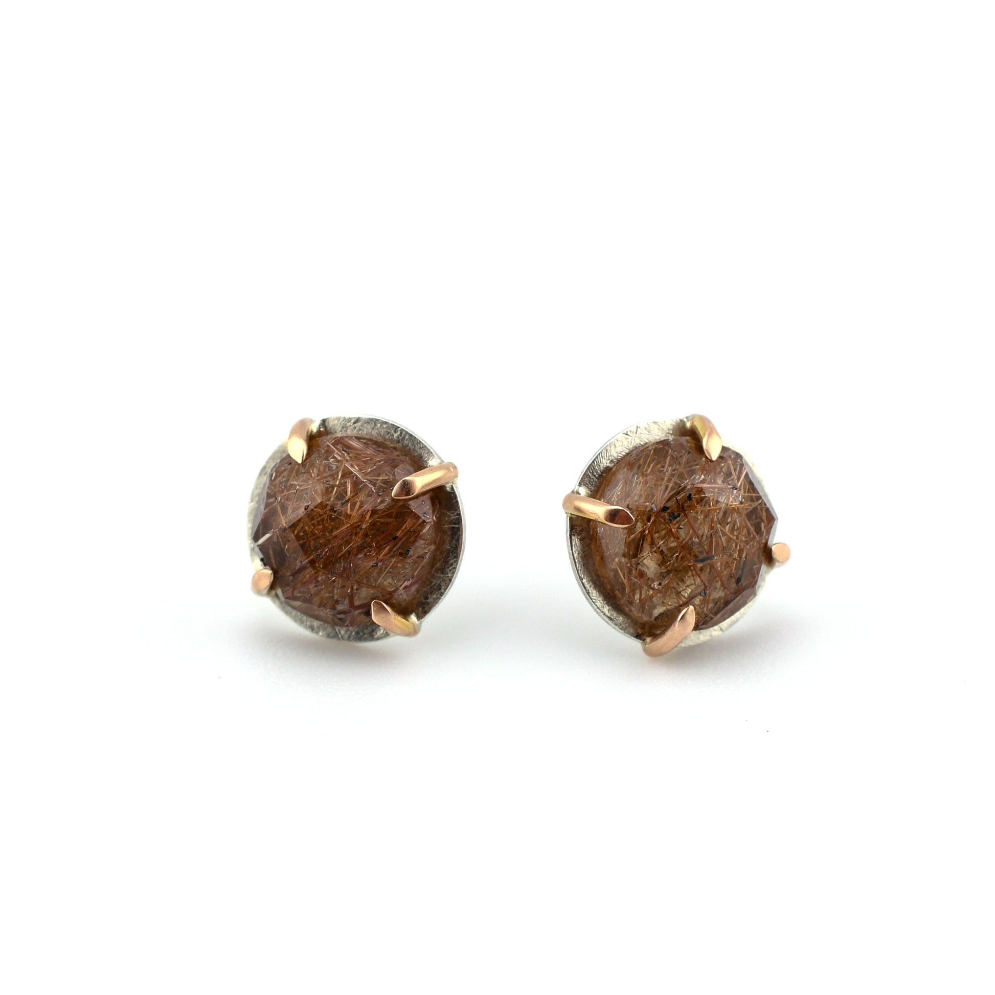 Rutilated quartz stud earrings in silver and rose gold on a white background