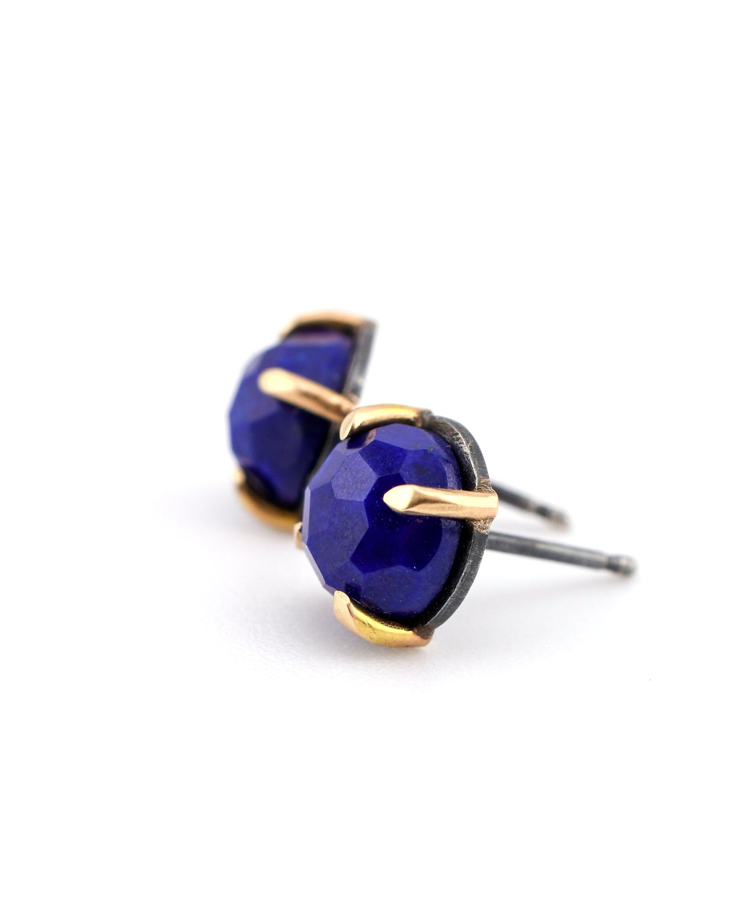 blackened silver and 14k gold stud earrings with lapis on a white background