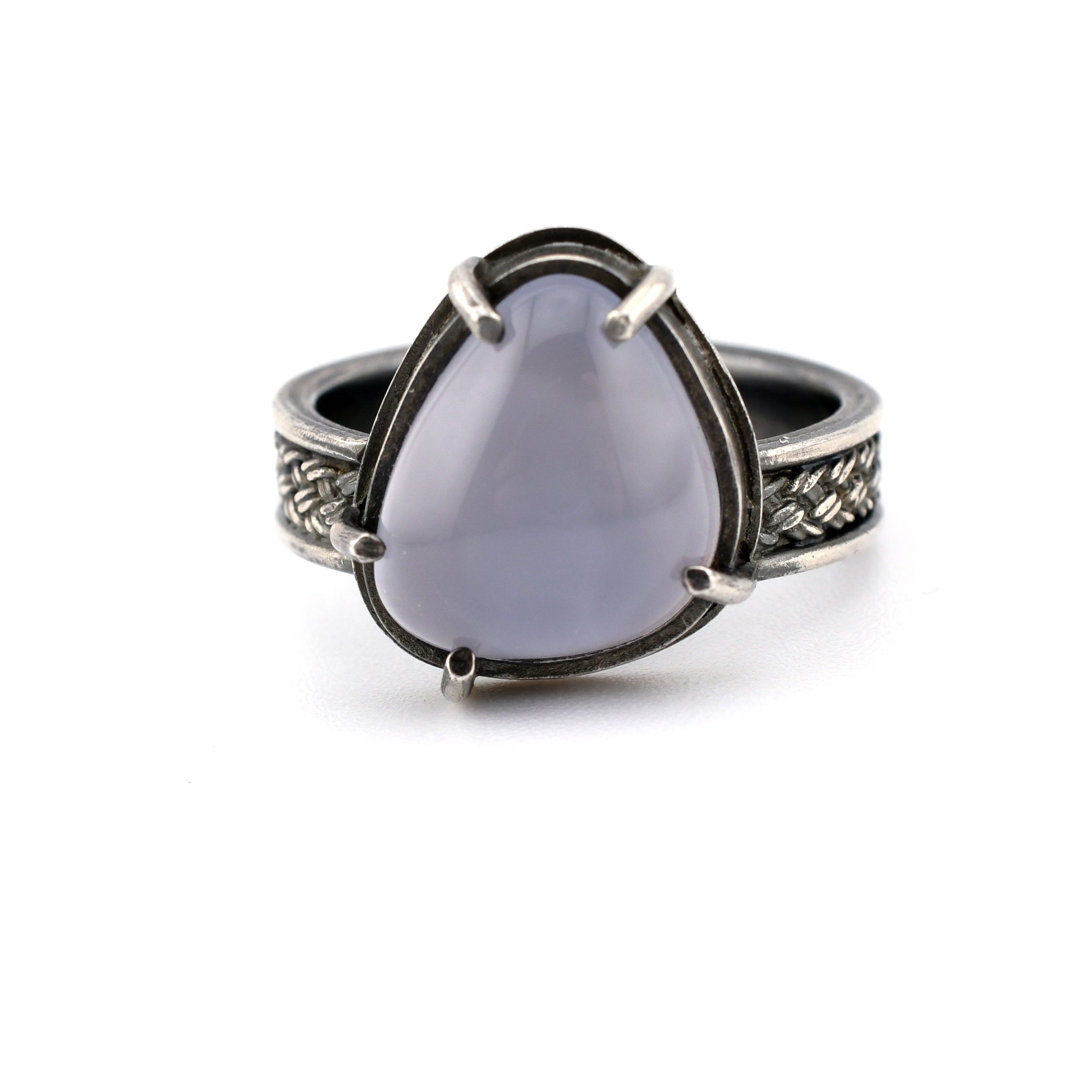 Ring with a purple stone on a white background