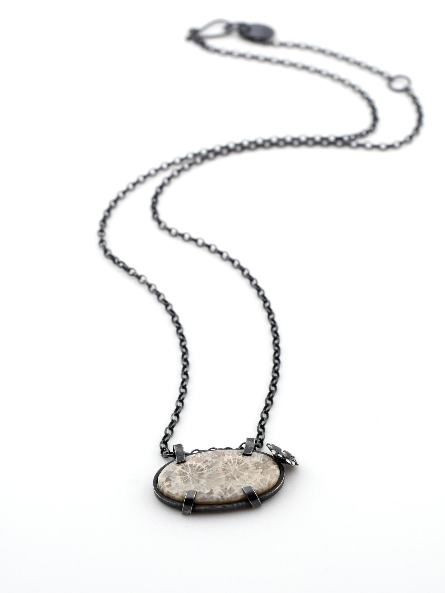 Necklace with a stone pendant on a white background