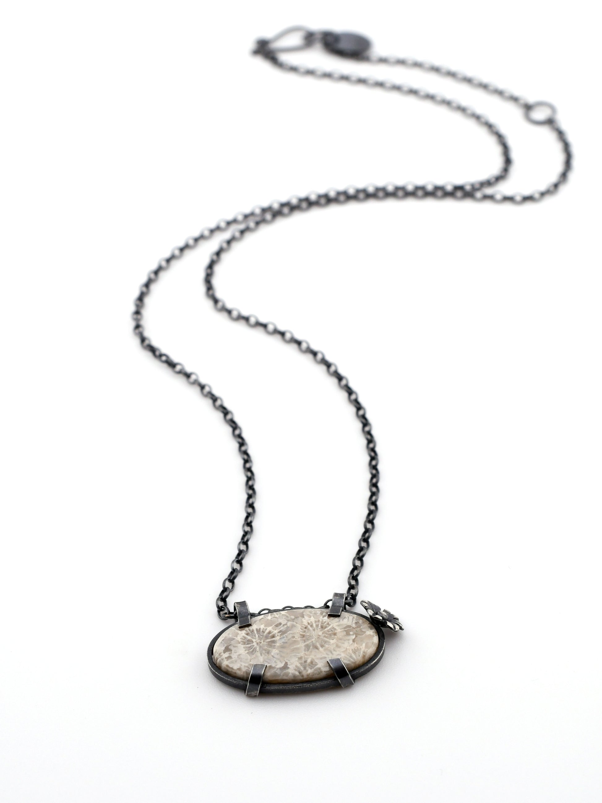 Necklace with a stone pendant on a white background