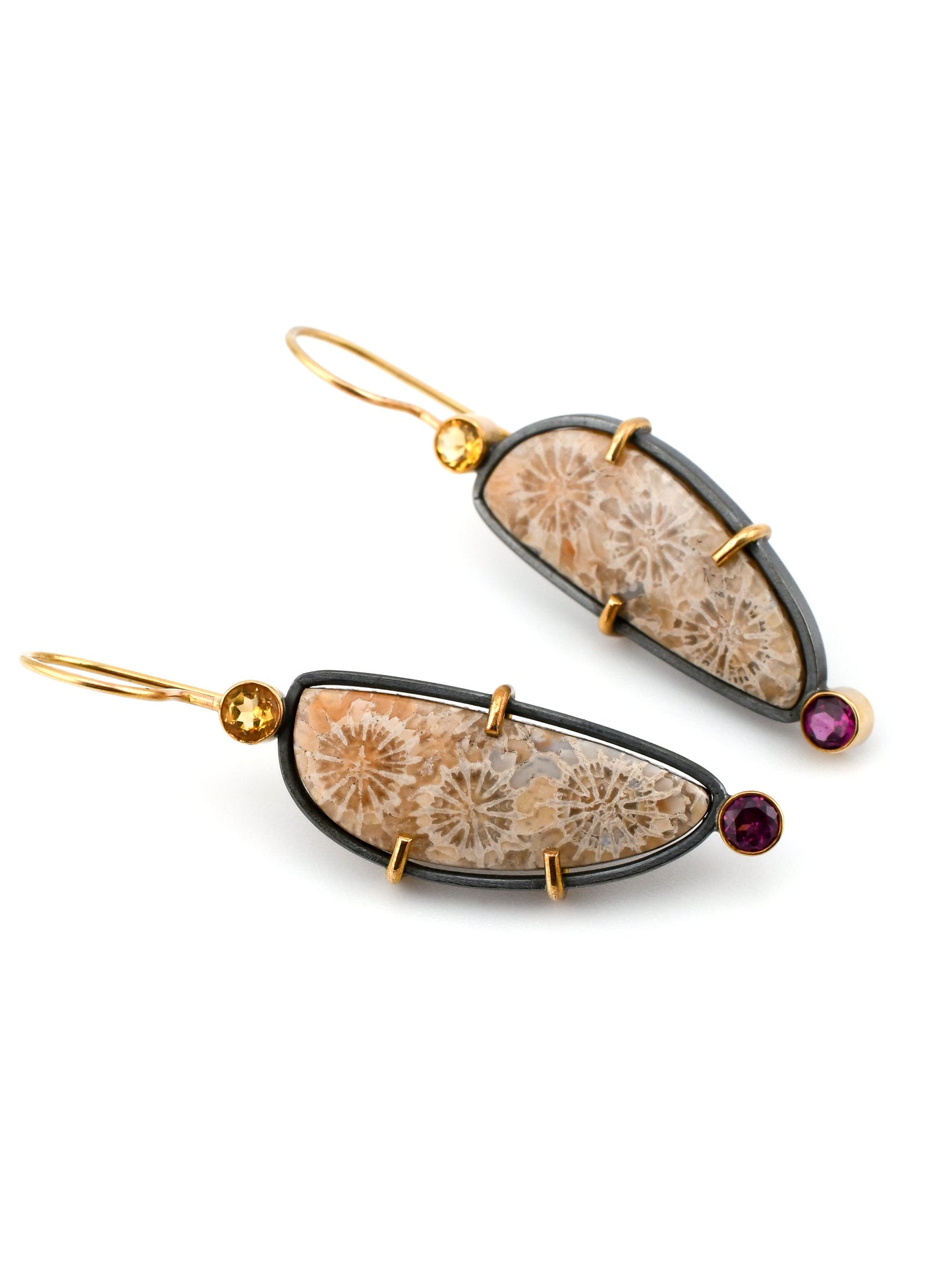 Pair of earrings with natural stone design and gold accents on a white background