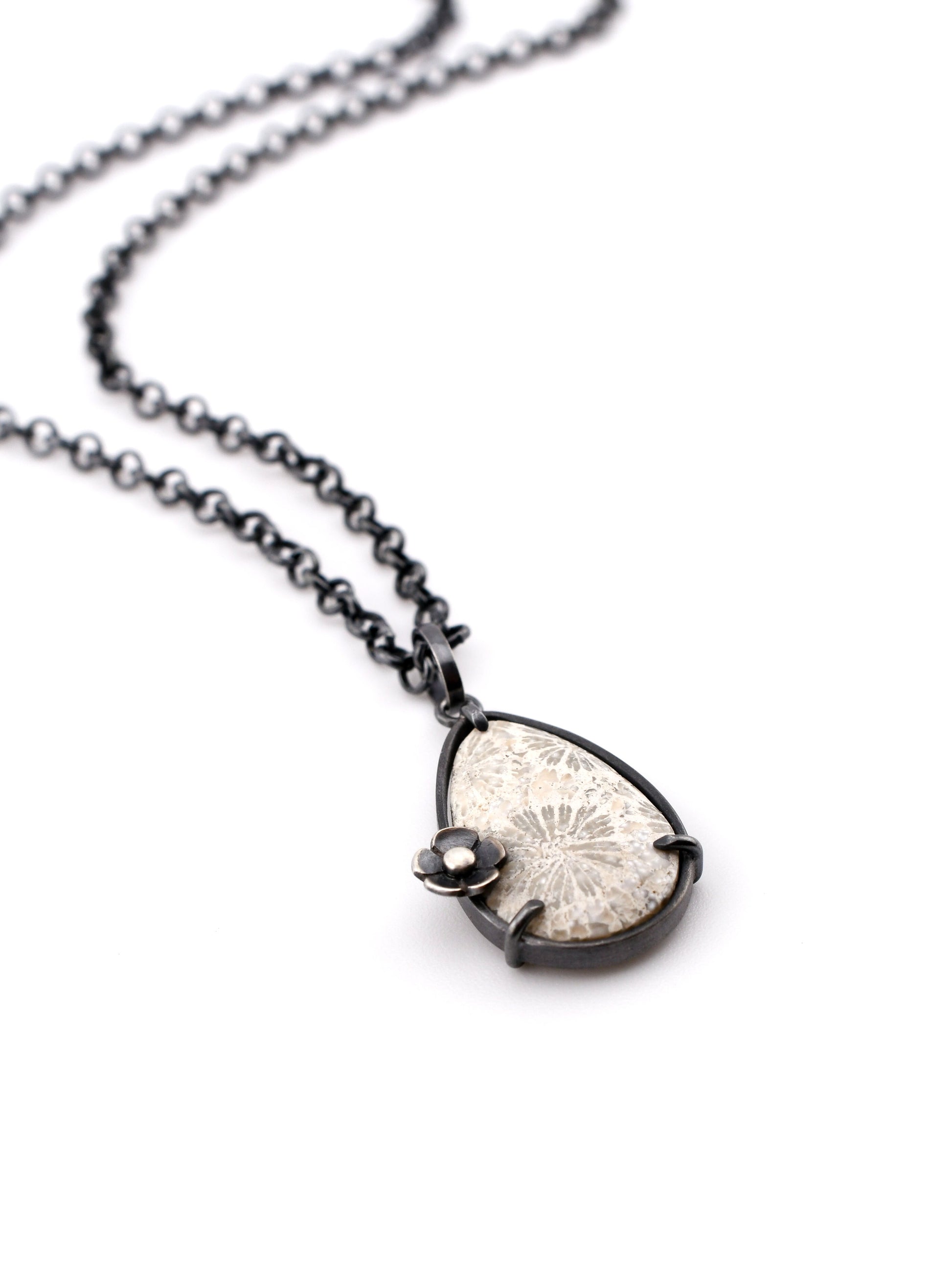 Necklace with a unique pendant on a white background