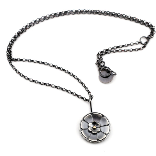Necklace with a floral pendant on a white background