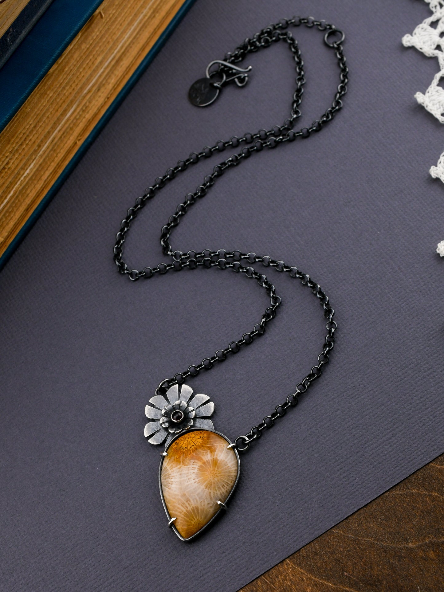 Necklace with a pendant on a dark surface