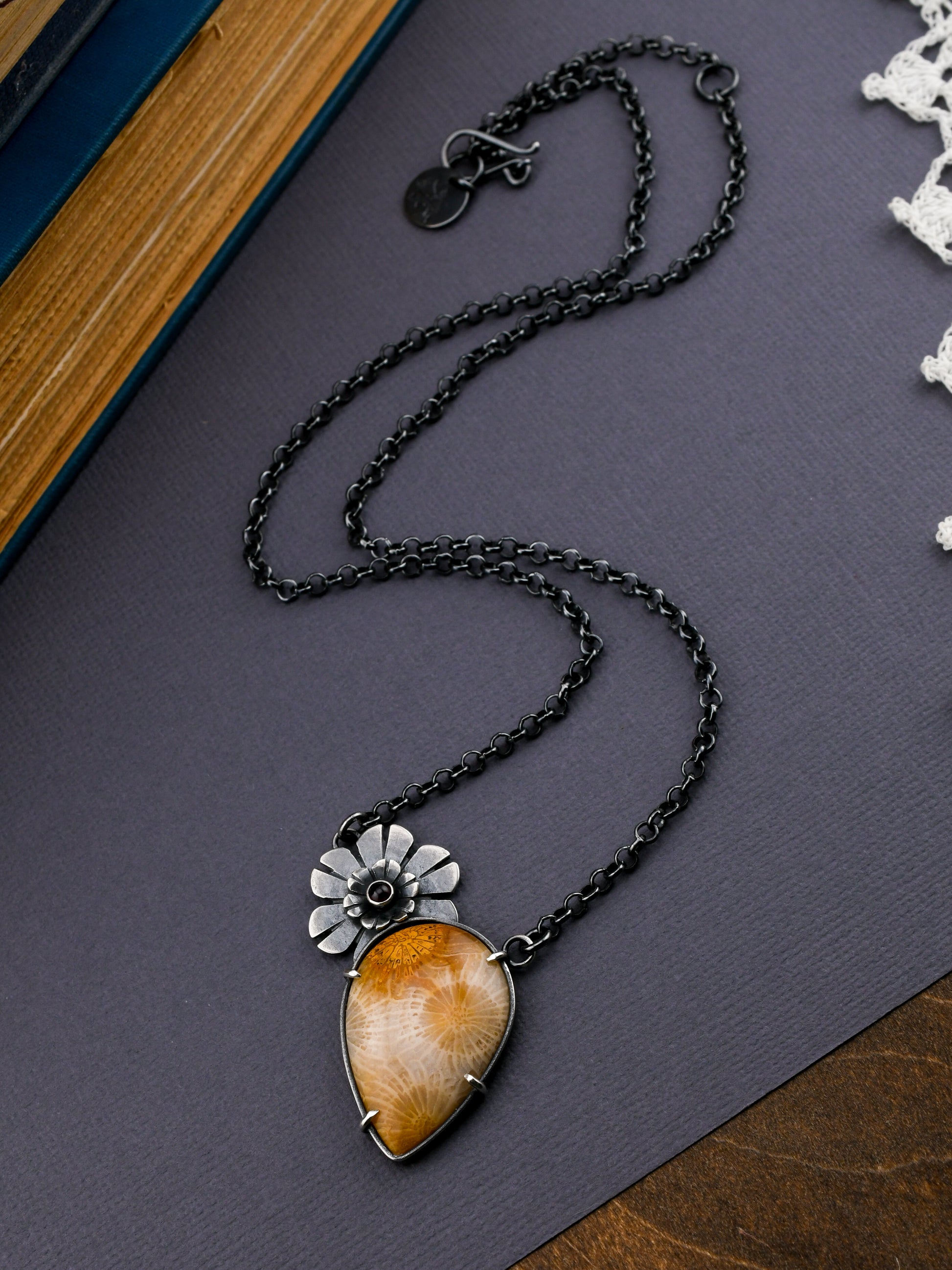 Necklace with a pendant on a dark surface