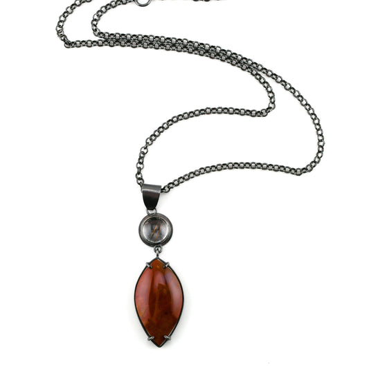 Necklace with a red pendant on a white background