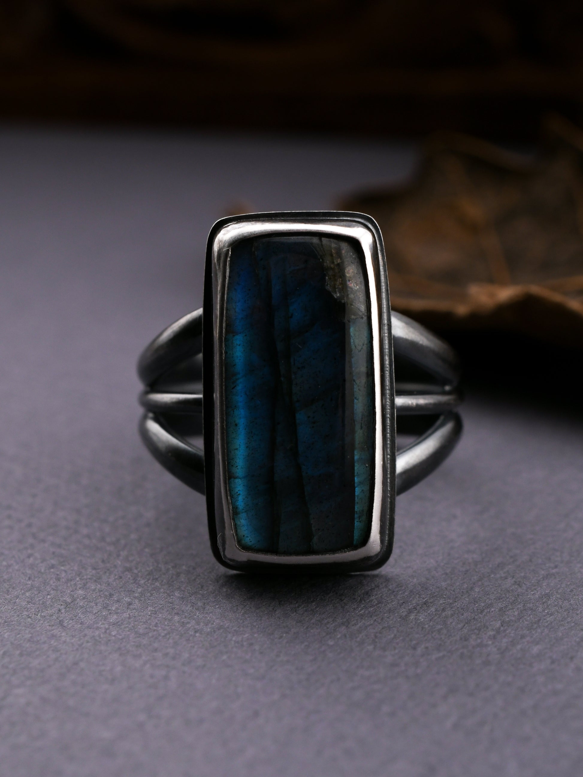 Ring with a blue stone on a dark background