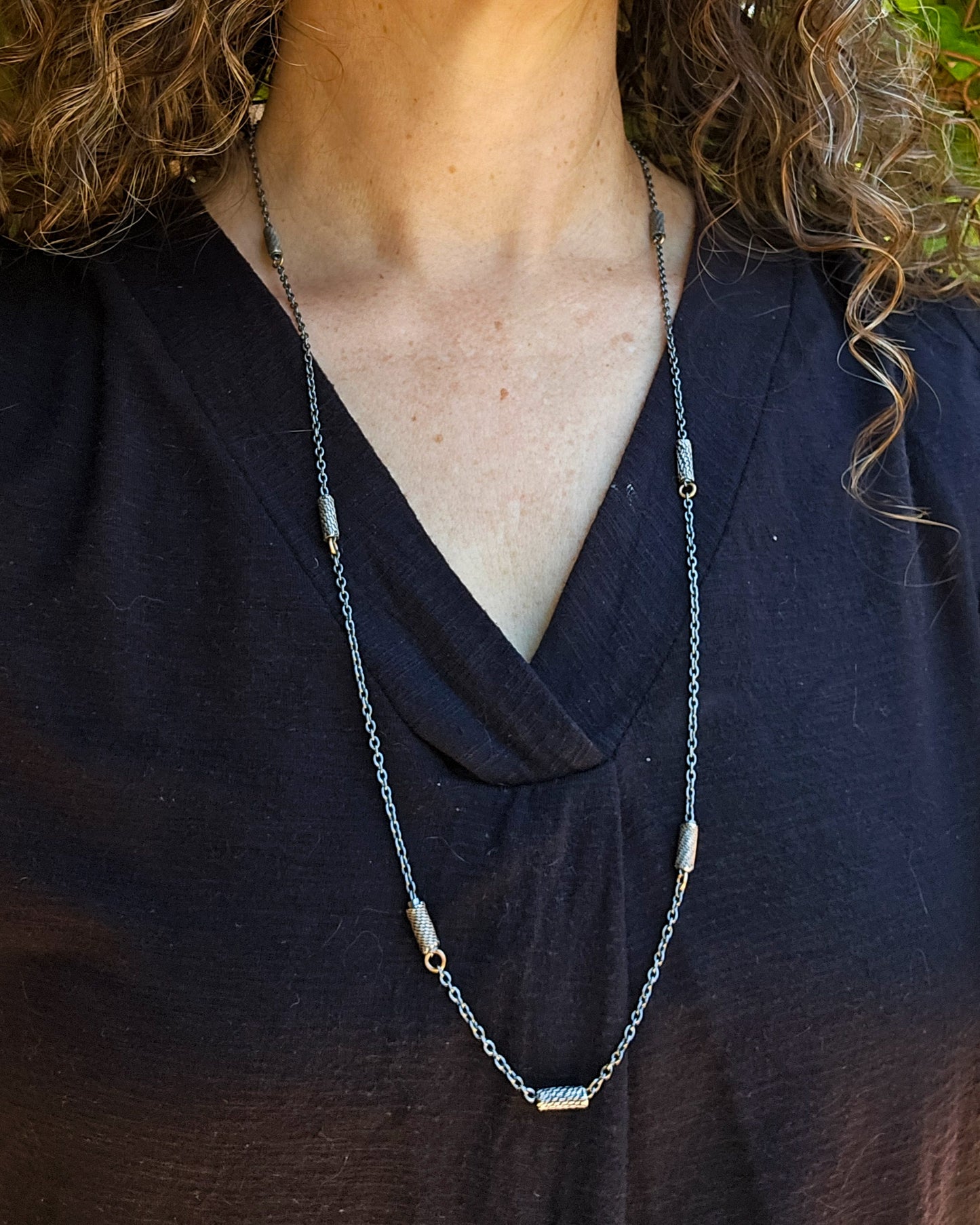 long slider necklace worn at its longest length