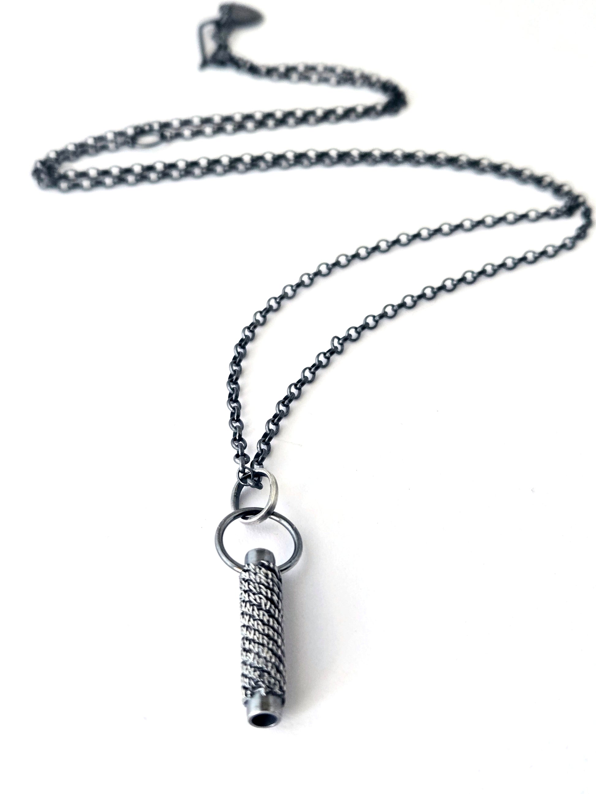 Silver pendant necklace on a white background