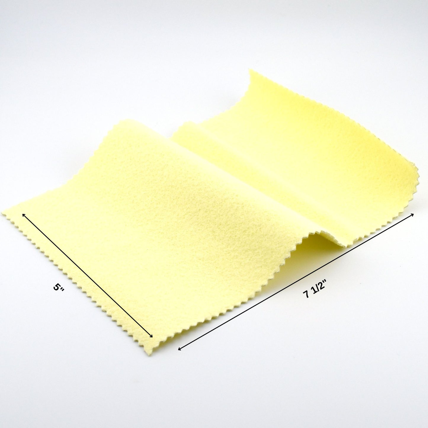 Yellow microfiber cloth with measurements on a white background