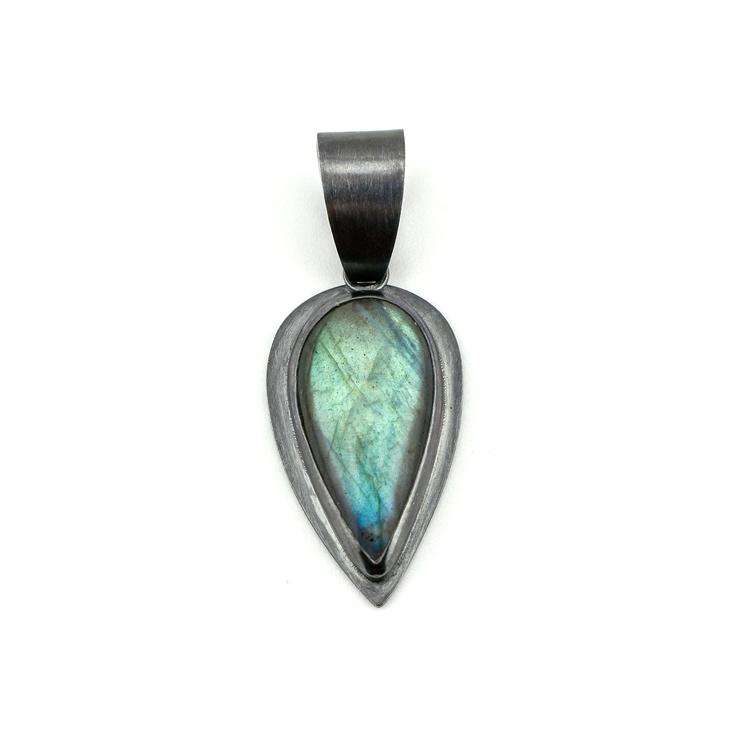 Teardrop-shaped pendant with a labradorite stone on a white background