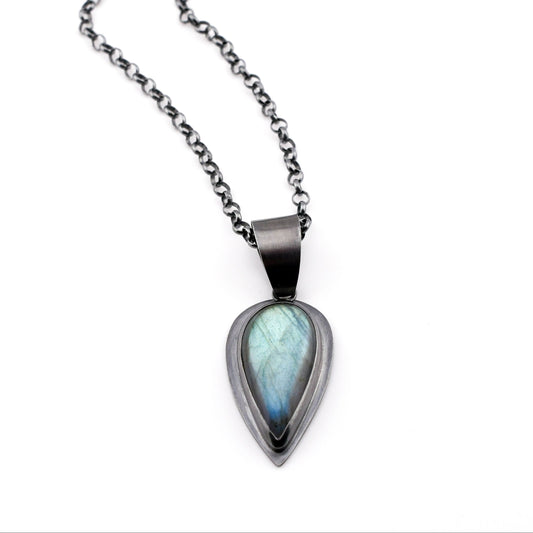 Necklace with a teardrop-shaped pendant on a white background