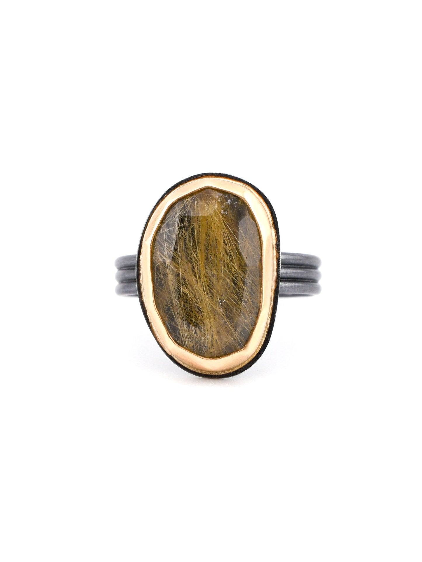 Black and gold rutilated quartz ring on a white background