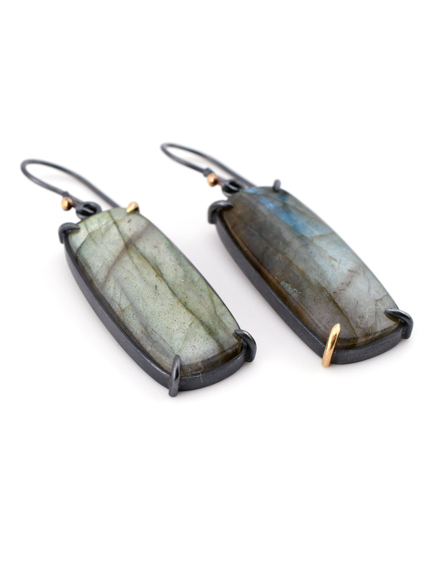 Pair of Labradorite earrings on a white background