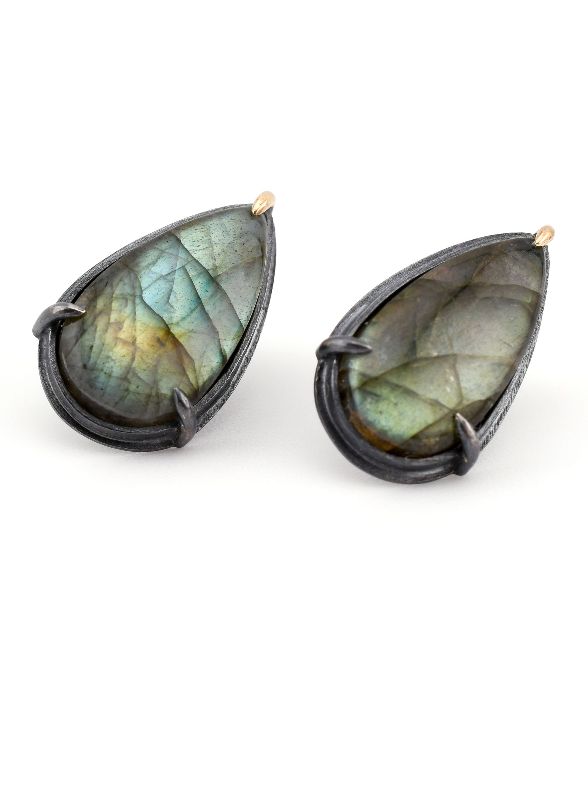 Teardrop-shaped labradorite earrings on a white background