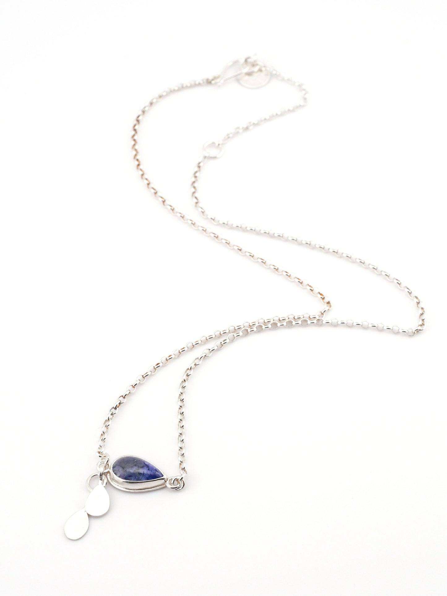 Necklace with a blue teardrop pendant on a white background
