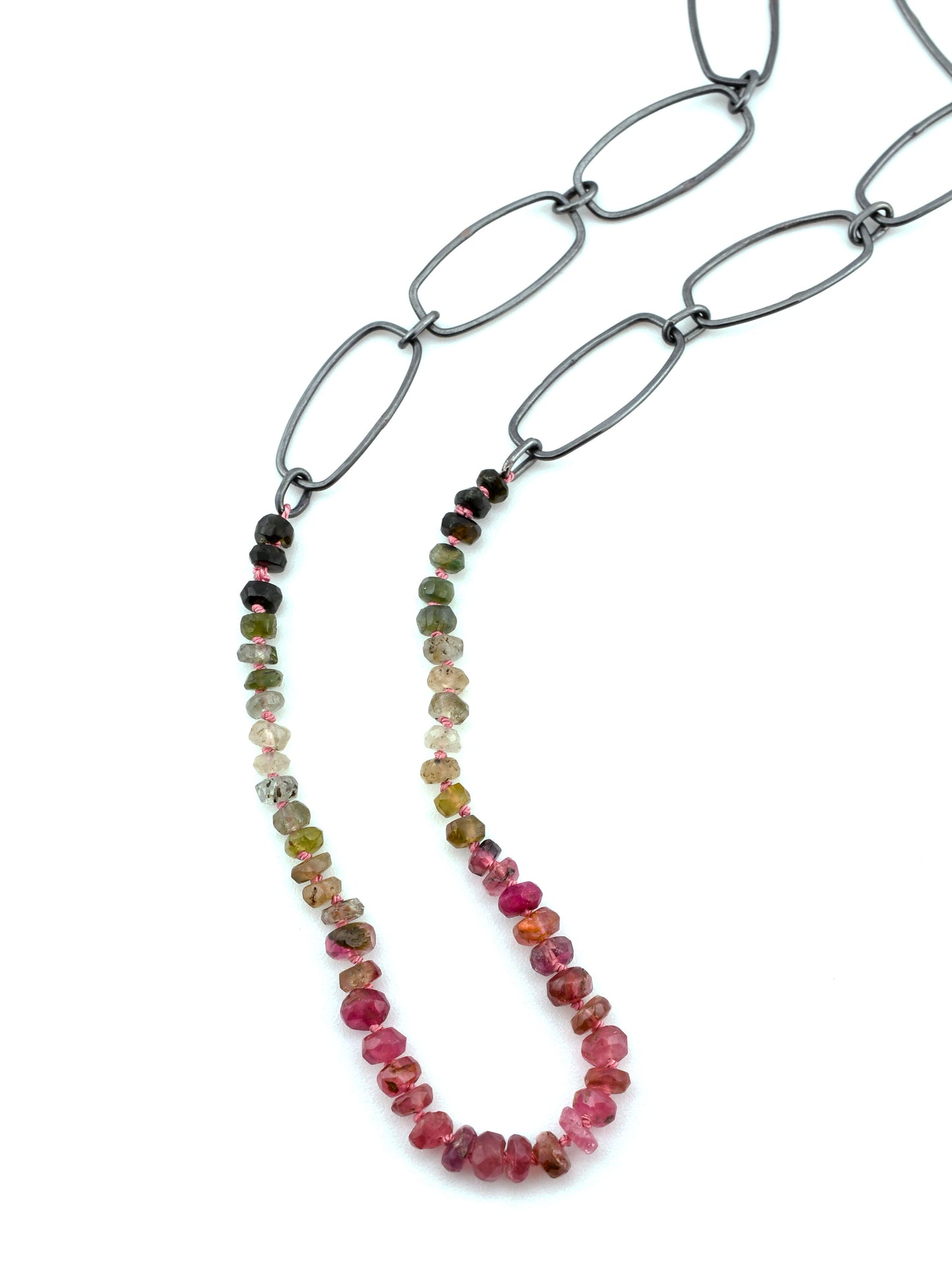 Necklace with multicolored beads on a white background