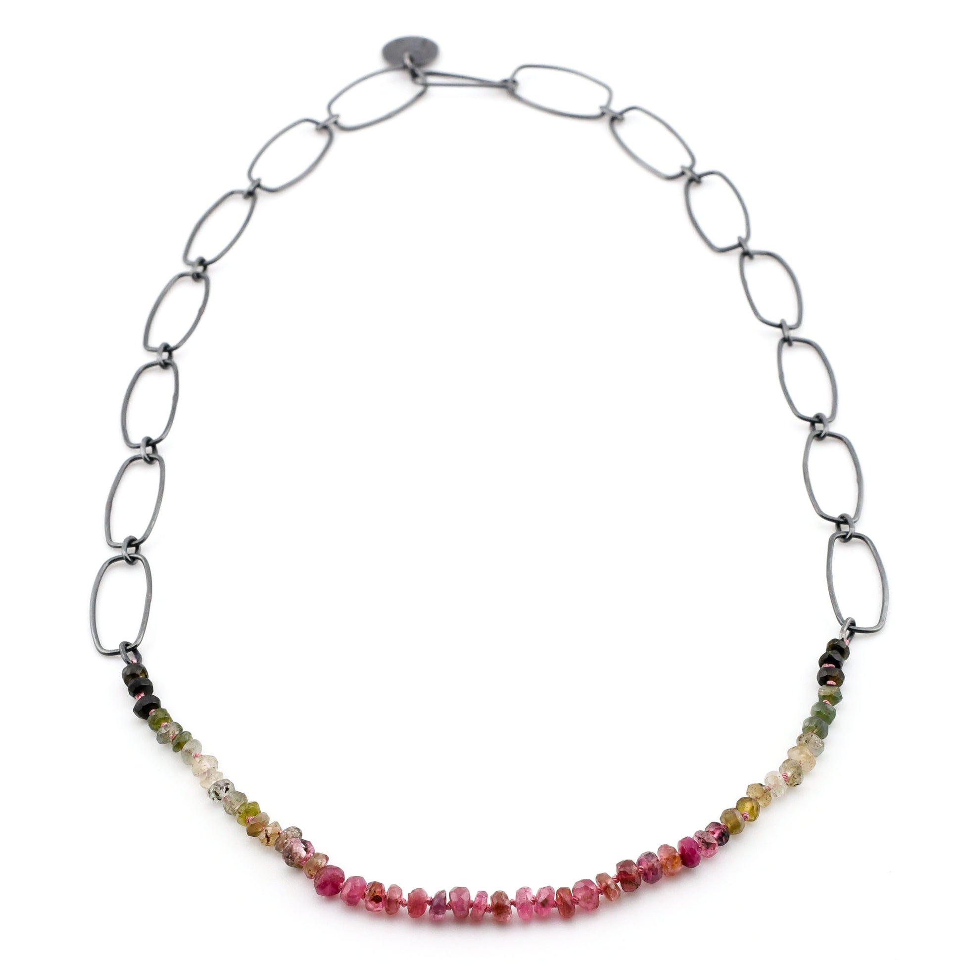 Necklace with multicolored gemstones on a white background