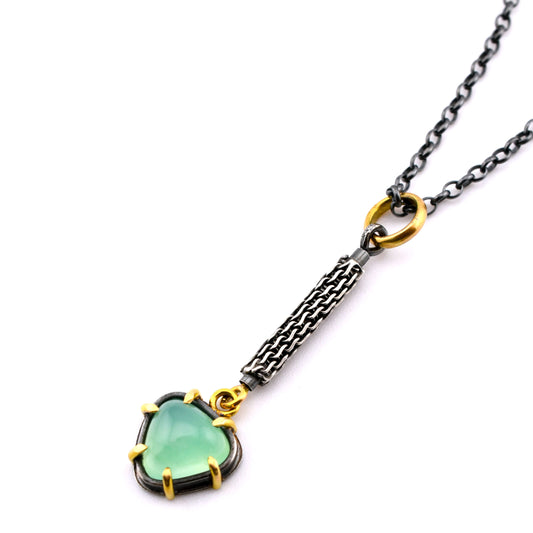 textured silver and green stone necklace with gold accents on a white background