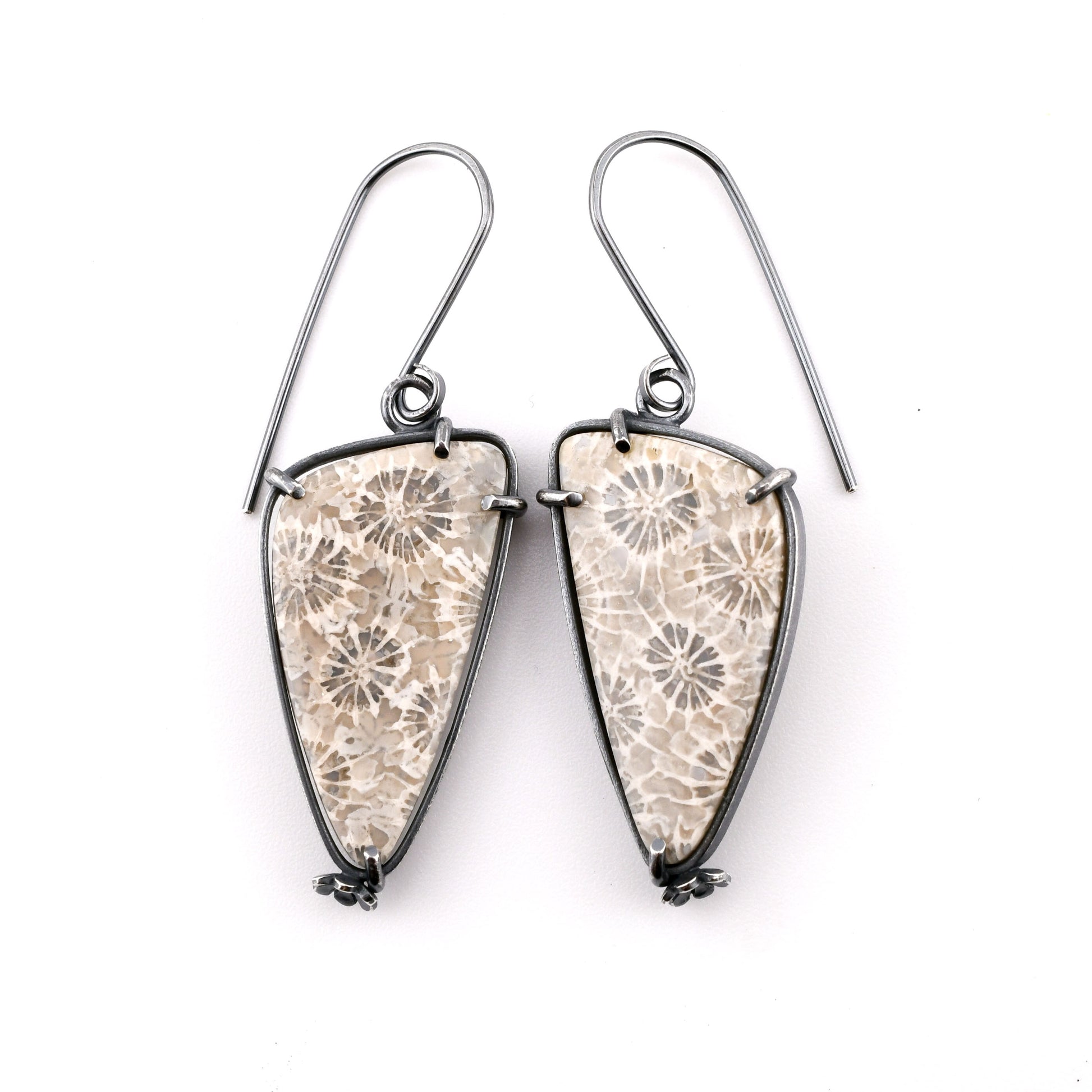 gray and white floral stone earrings on a white background