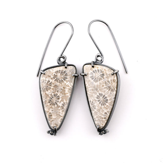 gray and white floral stone earrings on a white background