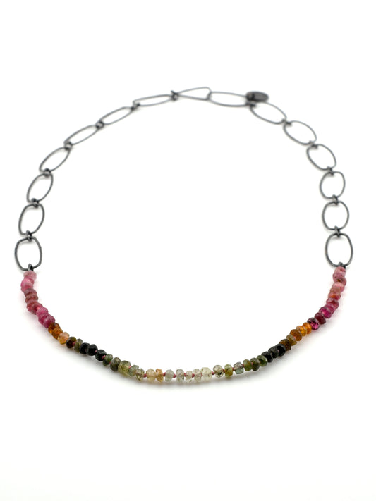 Necklace with multicolored beads on a white background