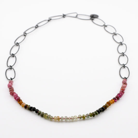 Necklace with multicolored beads on a white background
