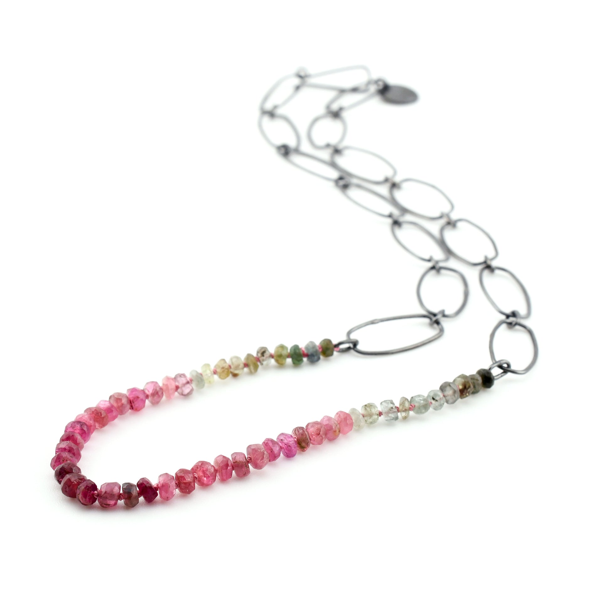 Necklace with multicolored beaded chain on a white background